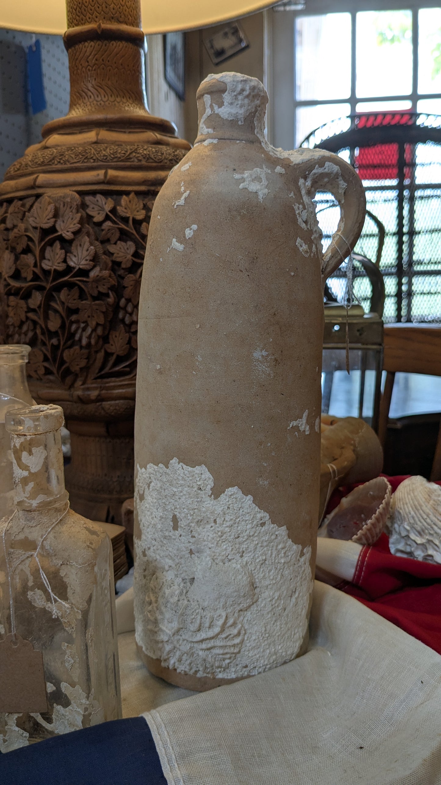 Antique Clay Bottle with Coral