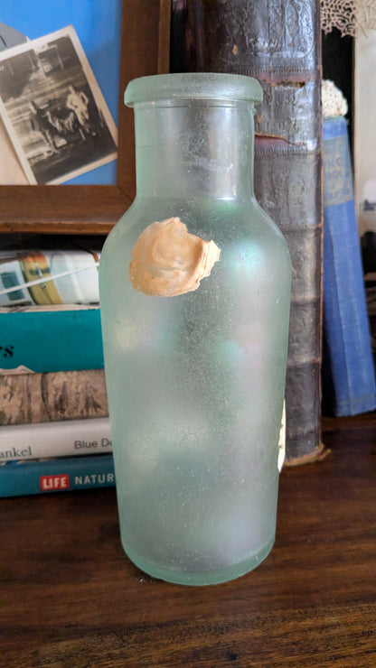 Antique Bottle with Barnacle Deposits